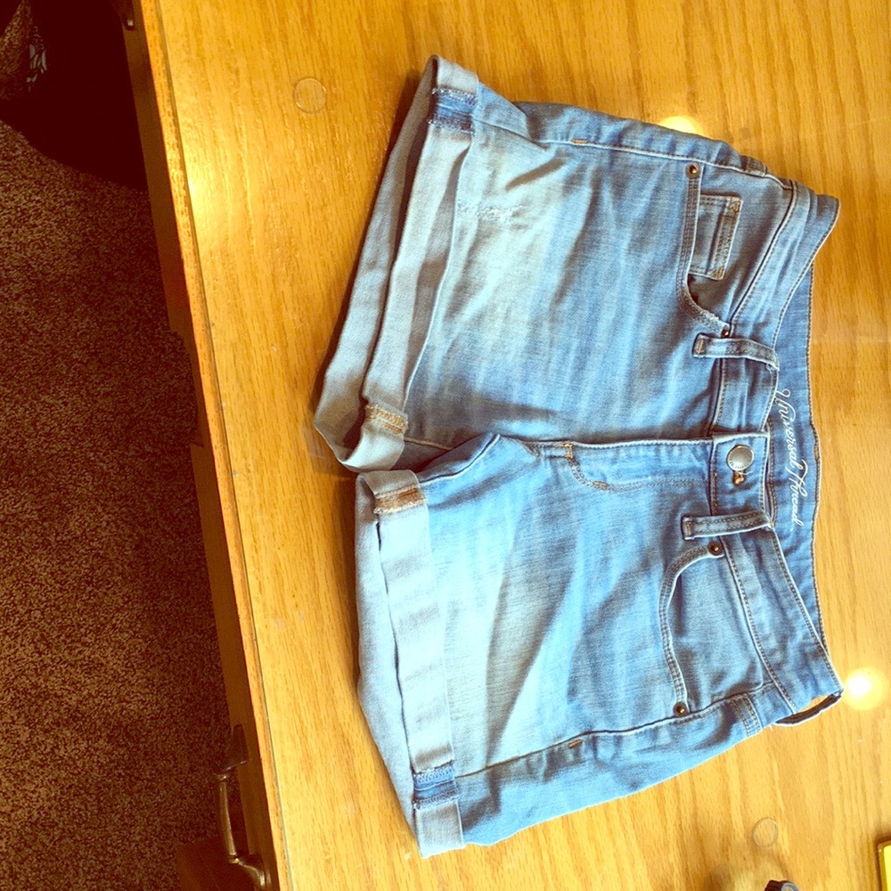 Light blue faded jean shorts